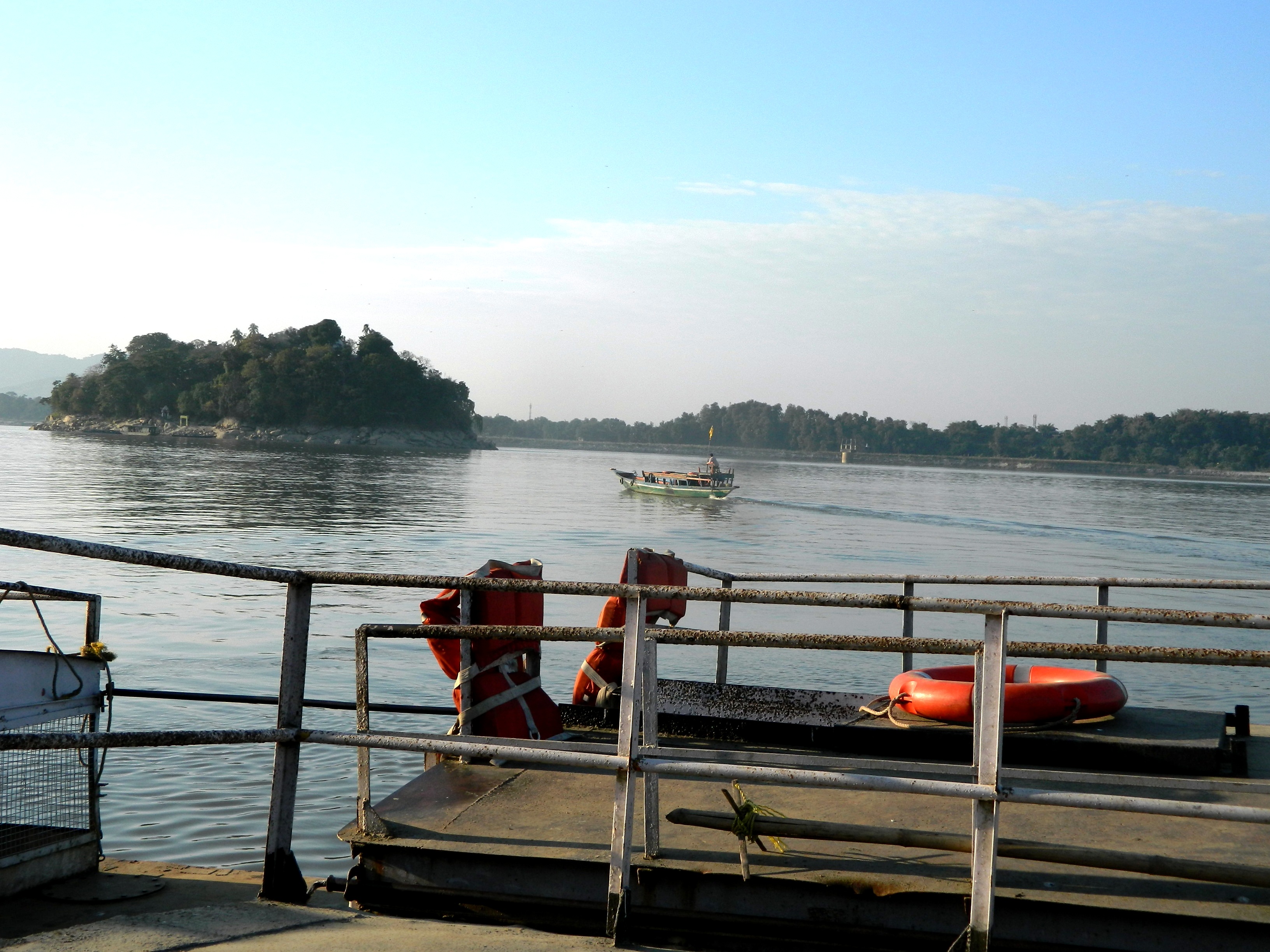 Expedition craft on the Brahmaputra approaching Umananda Peacock Island in Guwahati